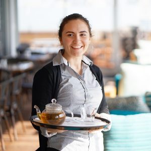 waitress carrying a tray